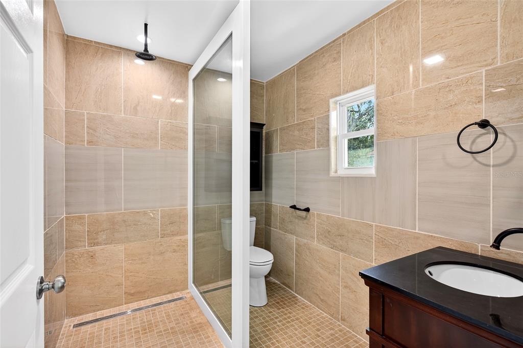 1110 Southwest Fort King Street Ocala, FL 34471 - Photo 11 of 30 a bathroom with a sink toilet and shower