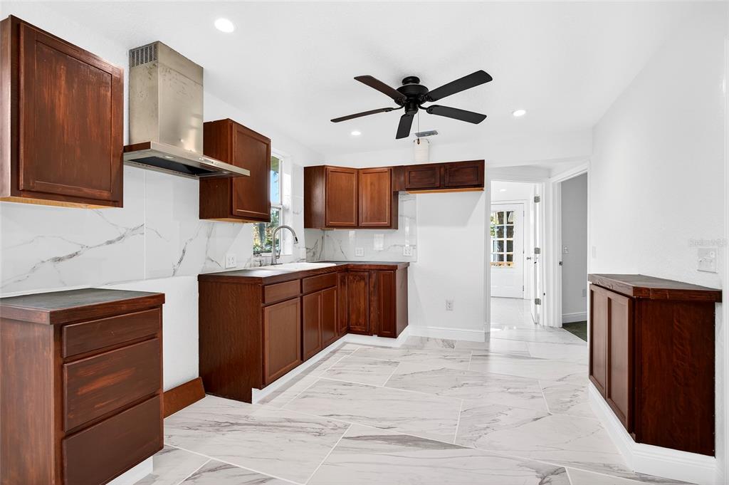 1110 Southwest Fort King Street Ocala, FL 34471 - Photo 15 of 30 a kitchen with a sink appliances and cabinets
