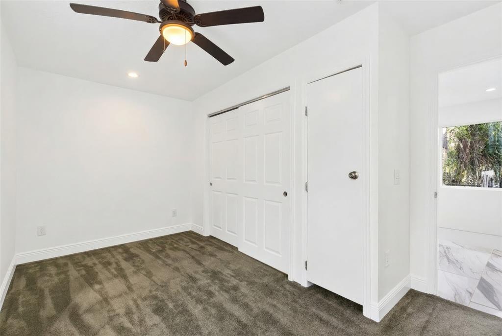 1110 Southwest Fort King Street Ocala, FL 34471 - Photo 22 of 30 a view of a room with a ceiling fan and a ceiling fan