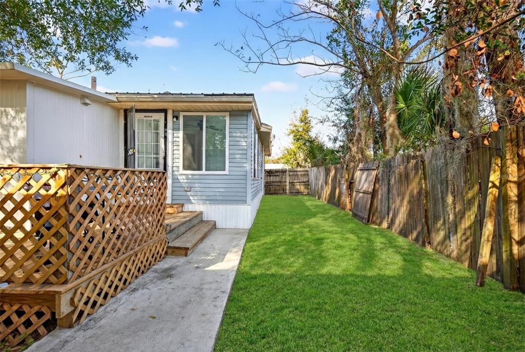 1110 Southwest Fort King Street Ocala, FL 34471 - Photo 27 of 30 a front view of a house with a yard