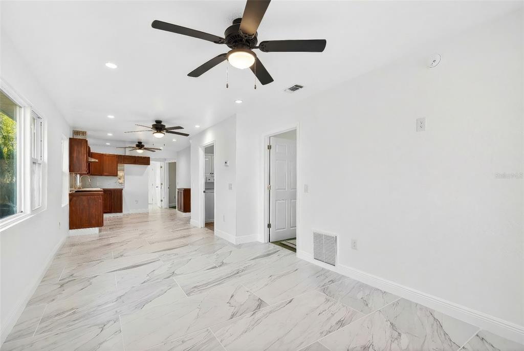 1110 Southwest Fort King Street Ocala, FL 34471 - Photo 6 of 30 a view of a kitchen with a sink and a refrigerator