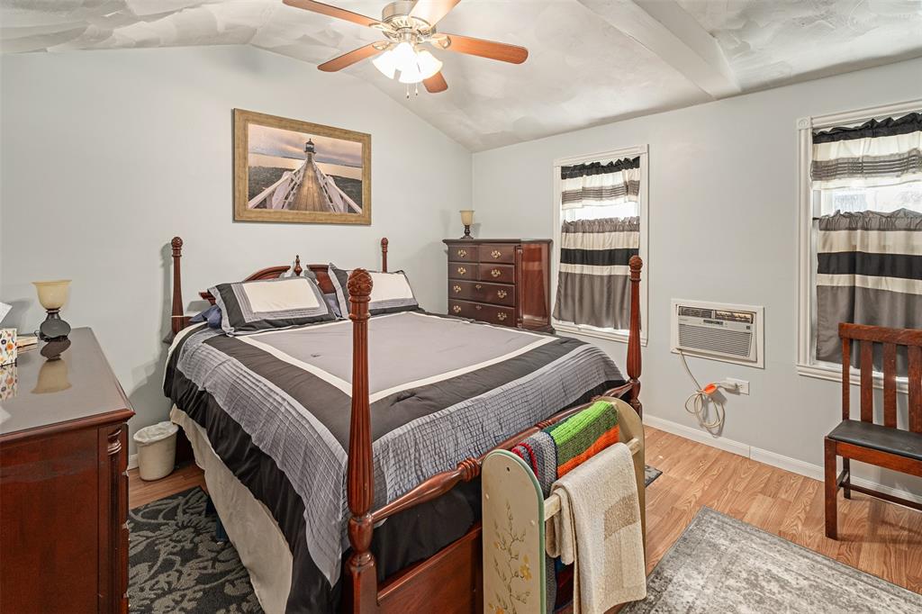 175 Kings Row Malakoff, TX 75148 - Photo 22 of 38 a bedroom with furniture and a chandelier