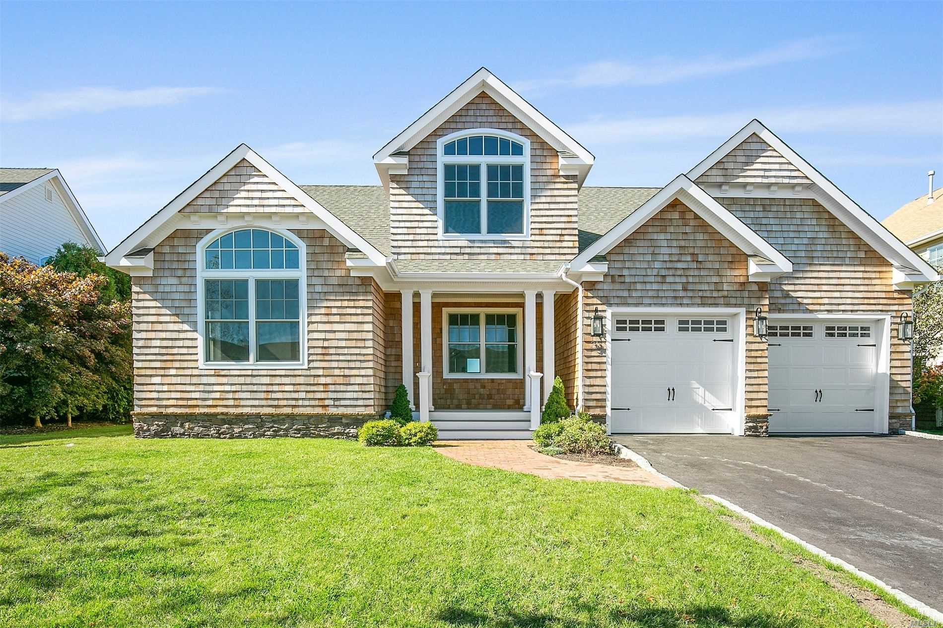 front view of a house and a yard