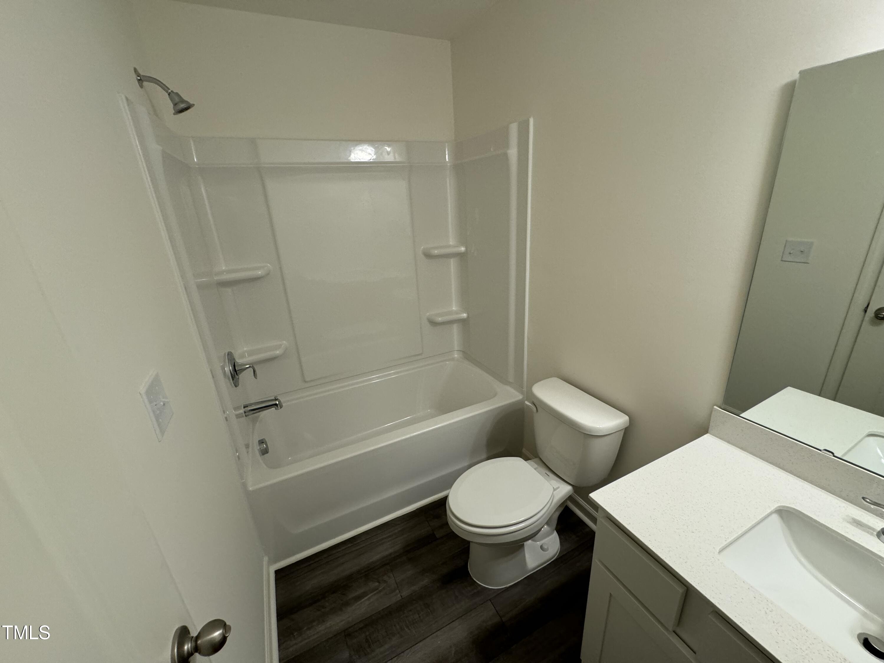 2000 Gln Xing Drive Durham, NC 27704 - Photo 14 of 18 a bathroom with a toilet a sink and bathtub