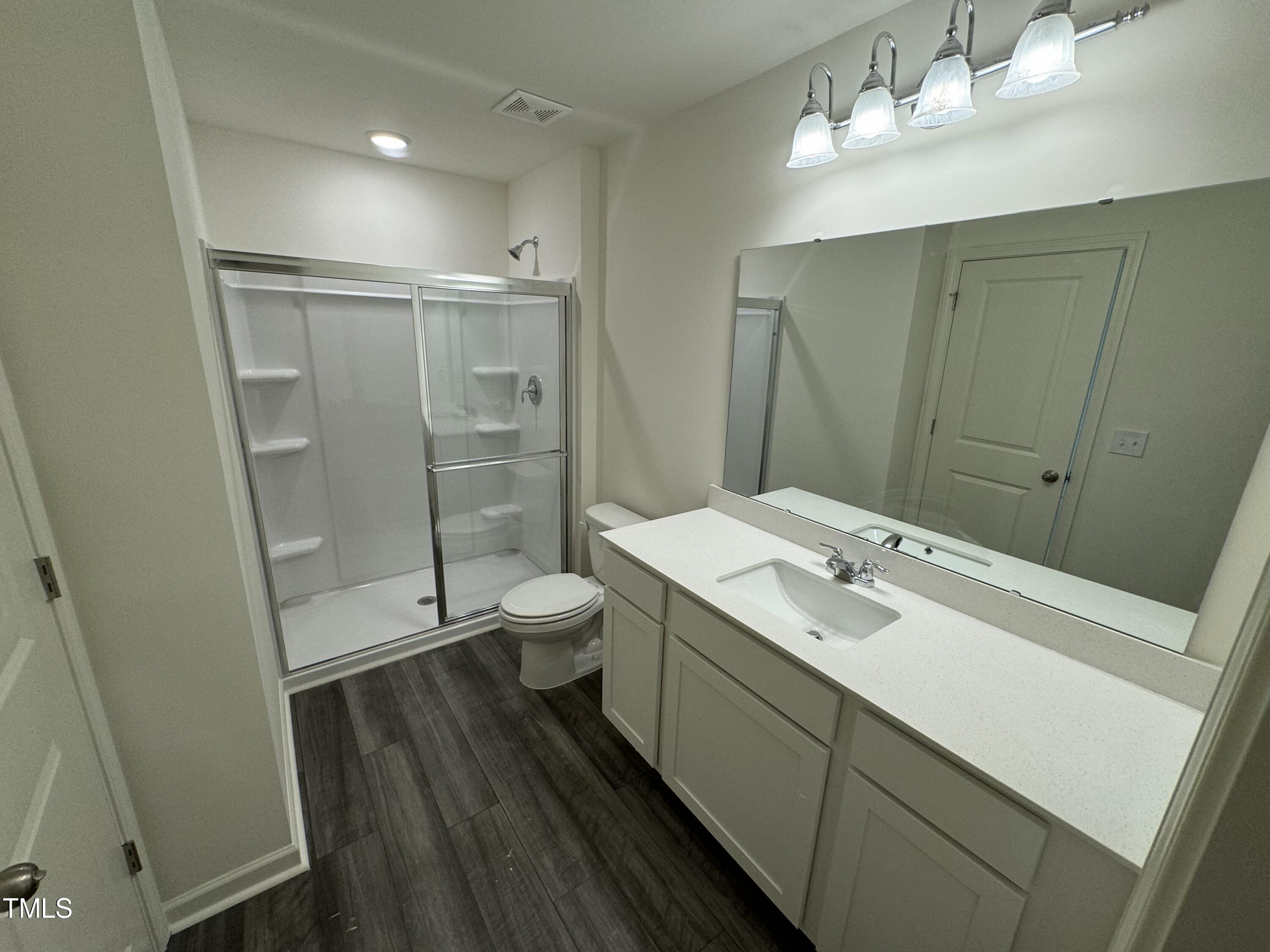 2000 Gln Xing Drive Durham, NC 27704 - Photo 15 of 18 a bathroom with a sink a toilet and shower
