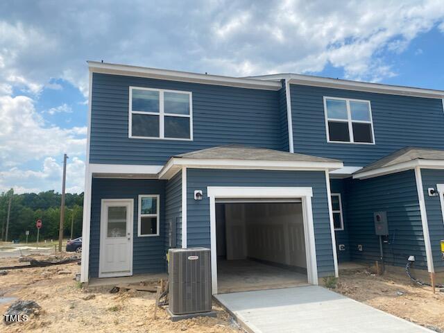2000 Gln Xing Drive Durham, NC 27704 - Photo 5 of 18 a front view of a house with a yard