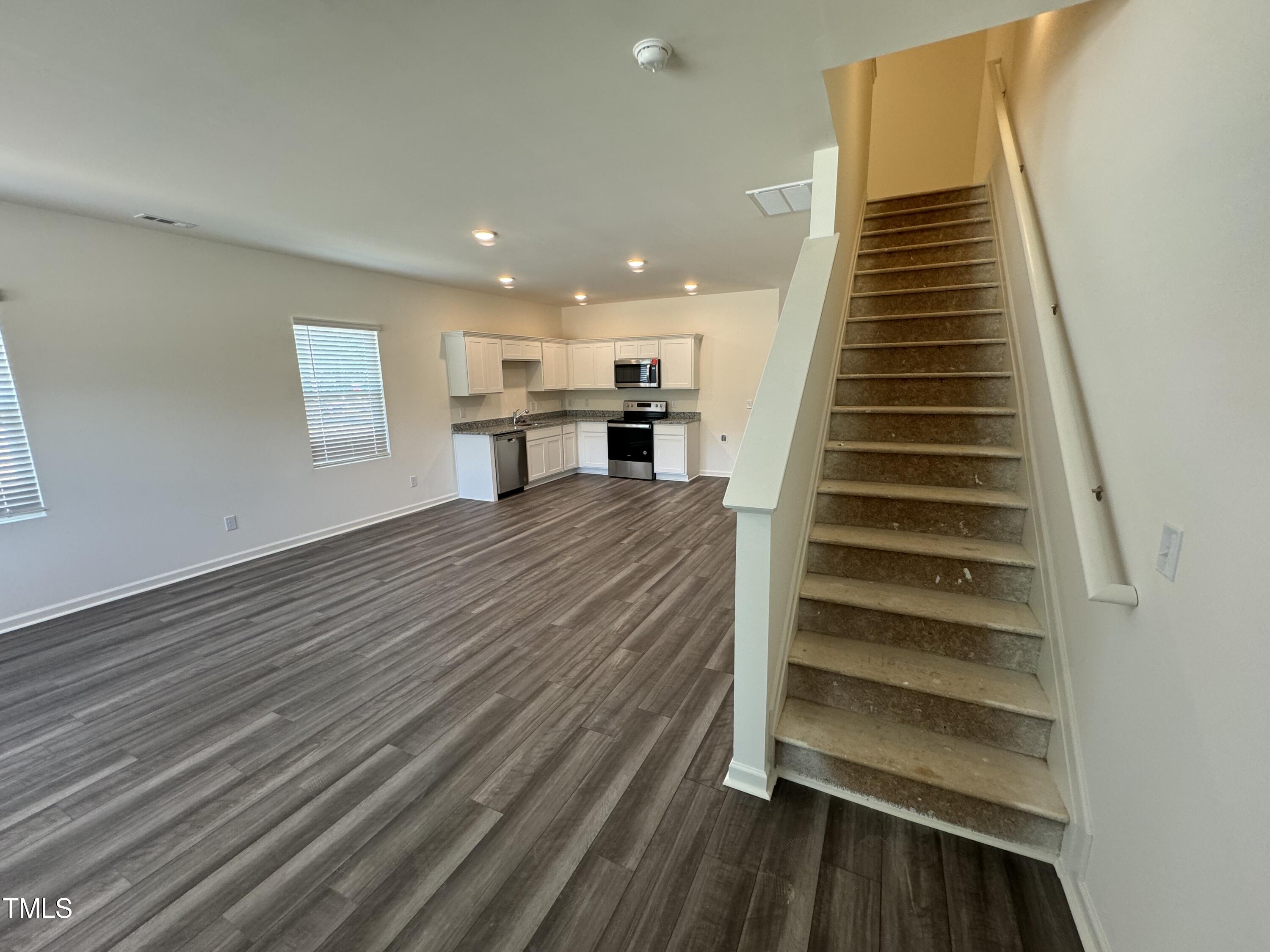 2000 Gln Xing Drive Durham, NC 27704 - Photo 6 of 18 a view of entryway and hall with wooden floor