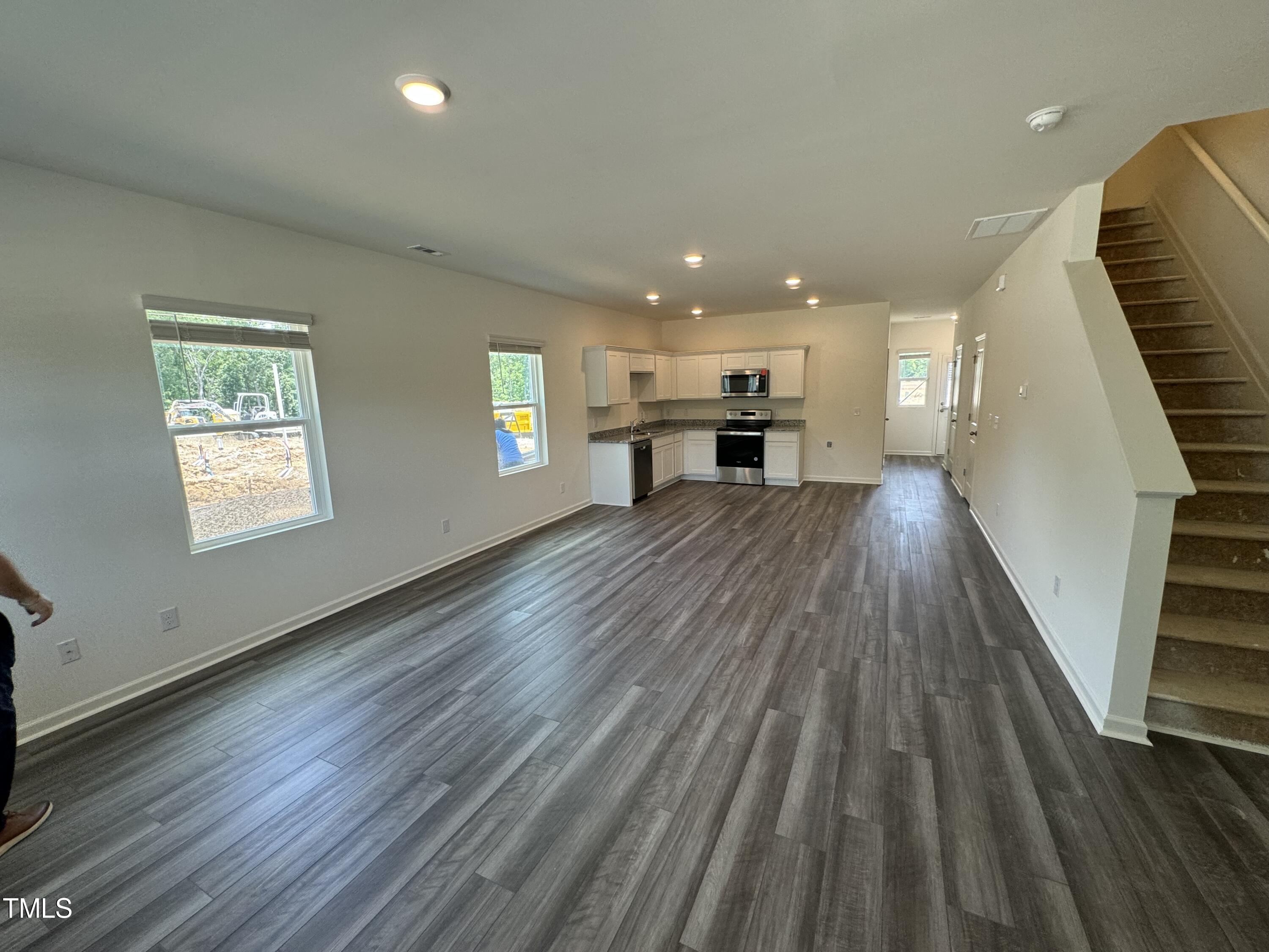 2000 Gln Xing Drive Durham, NC 27704 - Photo 7 of 18 a view of kitchen and hall with wooden floor