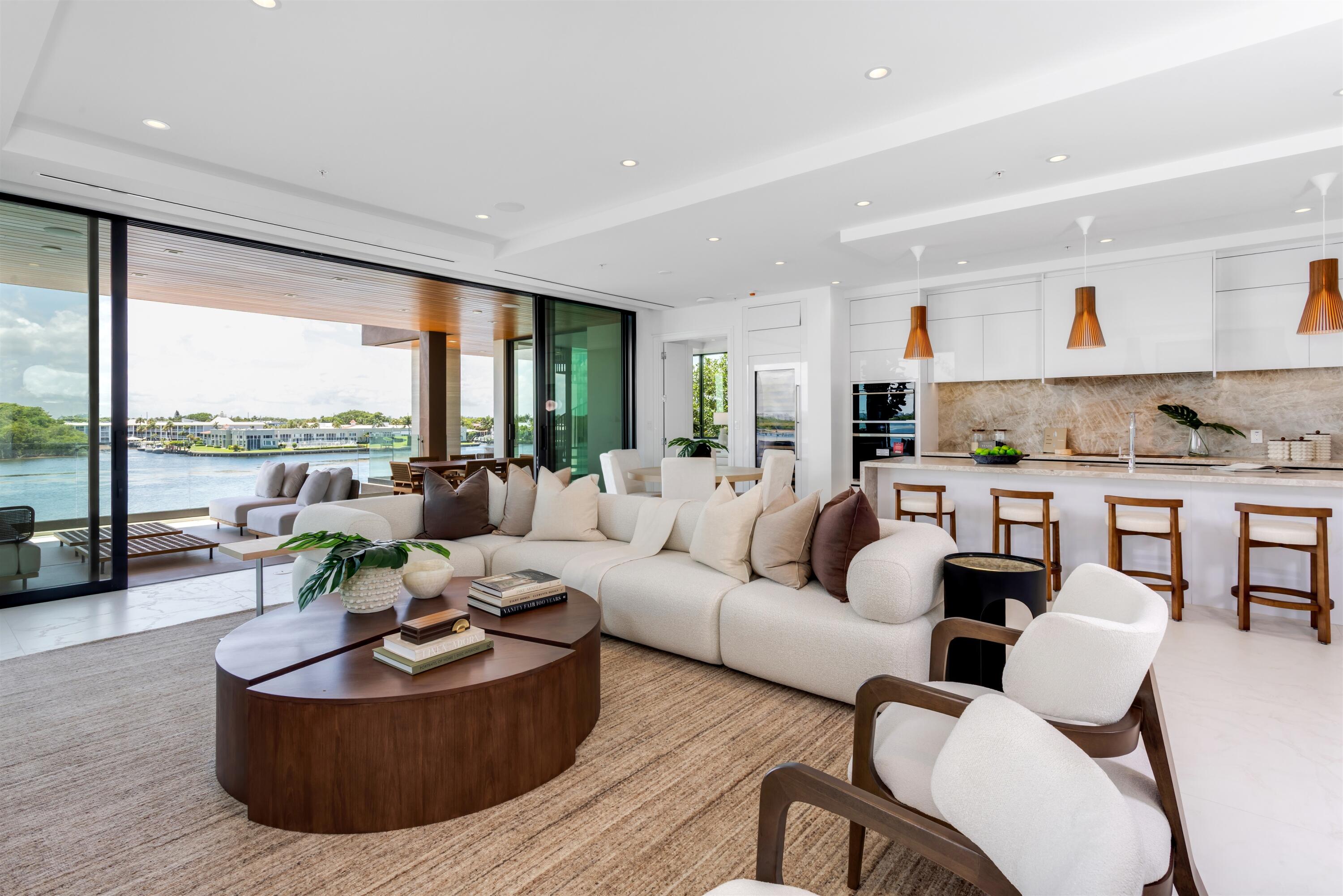 900 Lago Mar Lane, Unit PH Boca Raton, FL 33431 - Photo 5 of 58 a living room with furniture and a large window