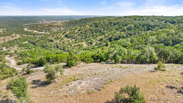 a view of a lake with a house in the background