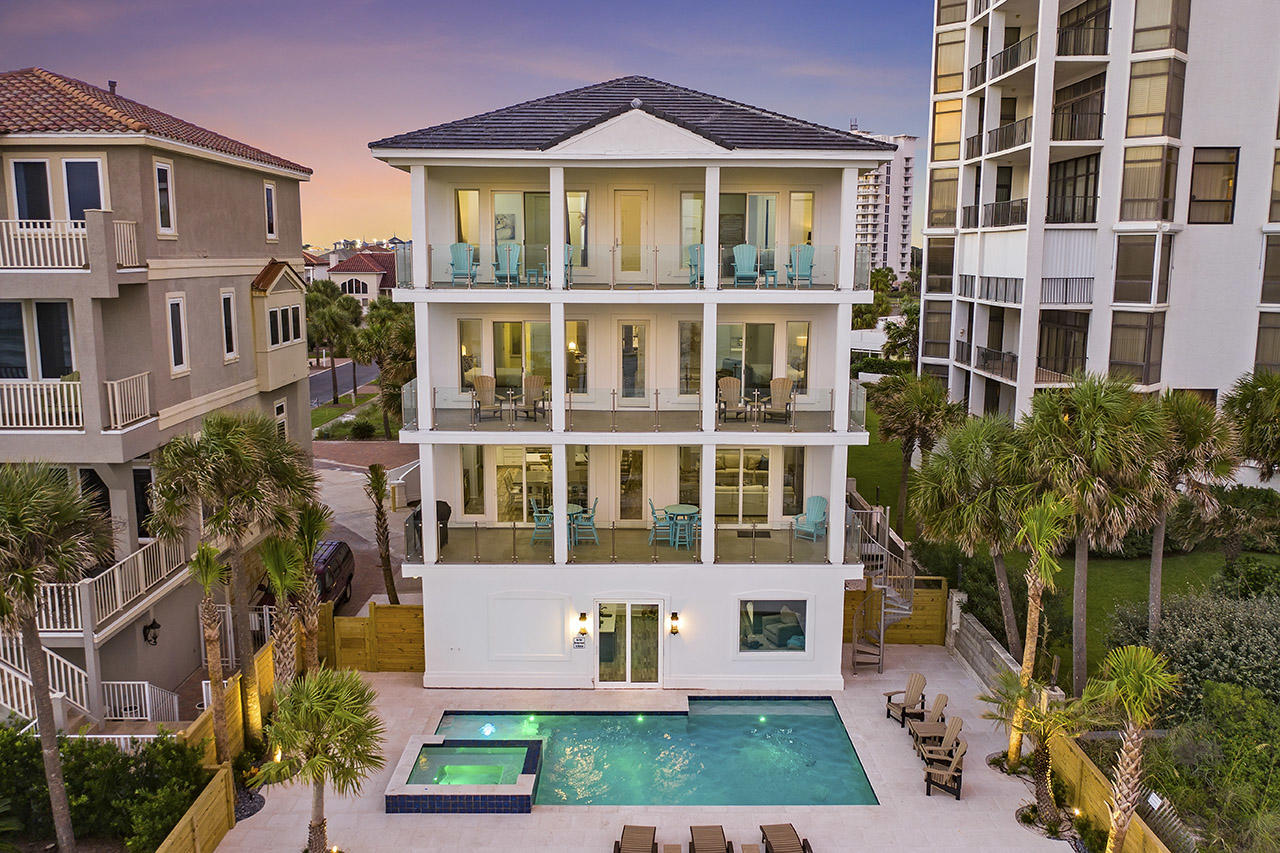 132 Sandprint Circle Destin, FL 32541 - Photo 1 of 117 a front view of a residential apartment building with a yard