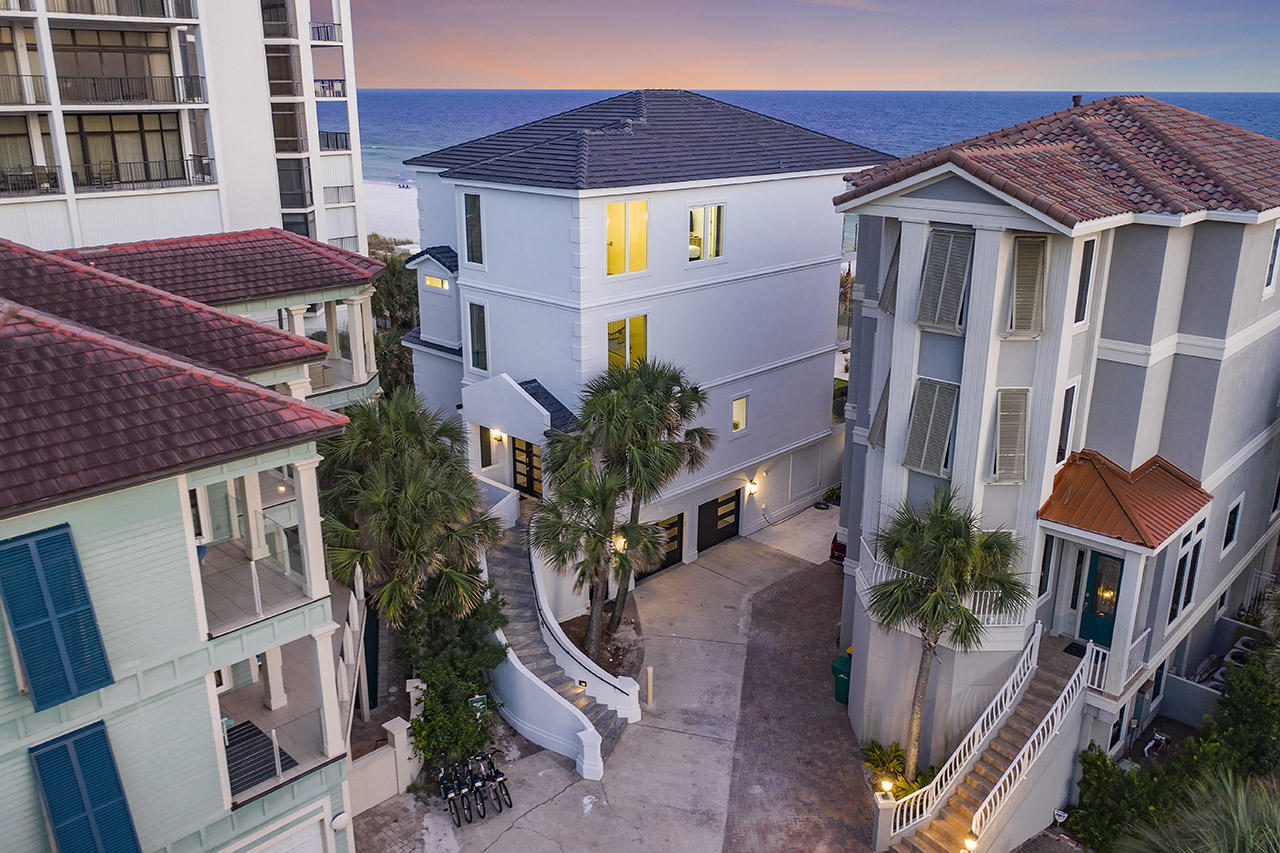 132 Sandprint Circle Destin, FL 32541 - Photo 114 of 117 a front view of a multi story residential apartment building with a yard