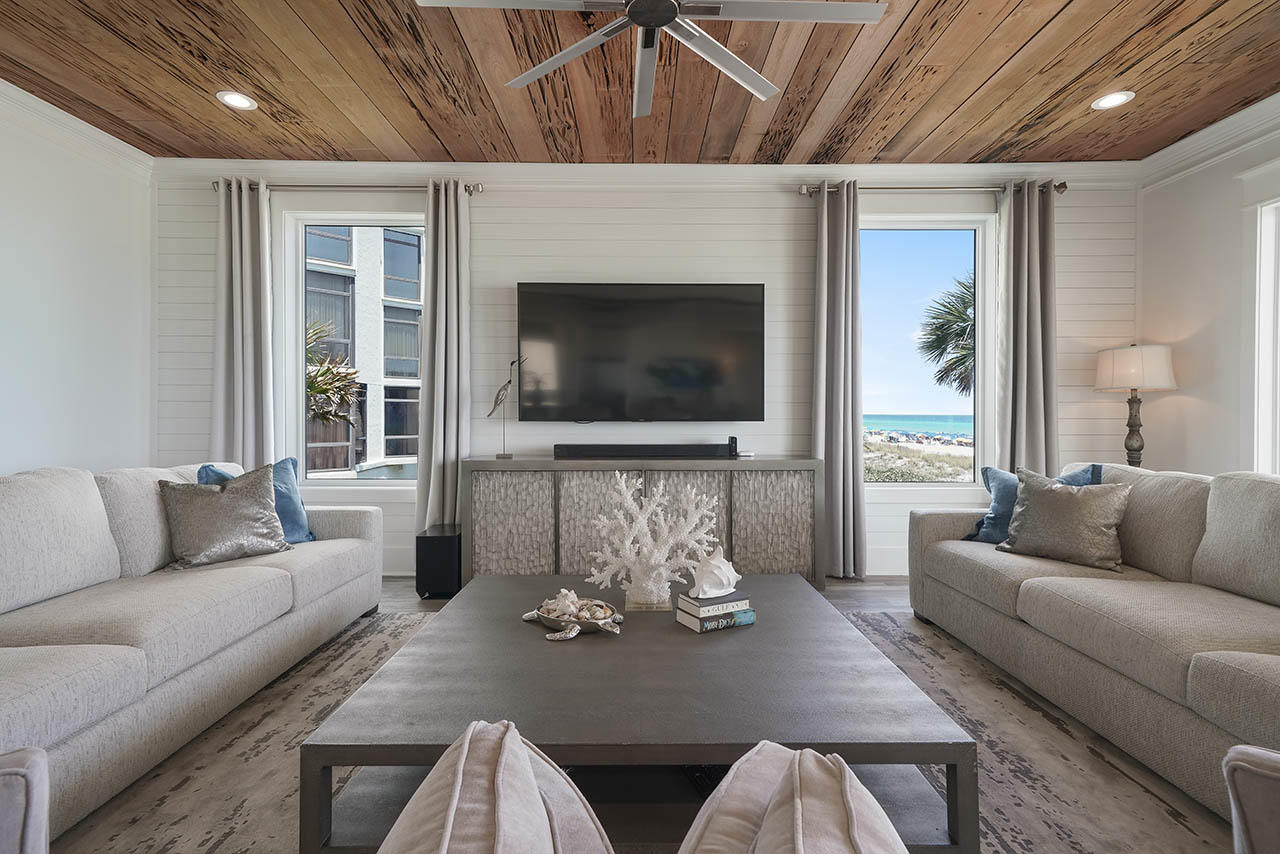 132 Sandprint Circle Destin, FL 32541 - Photo 18 of 117 a living room with furniture a flat screen tv and a fireplace