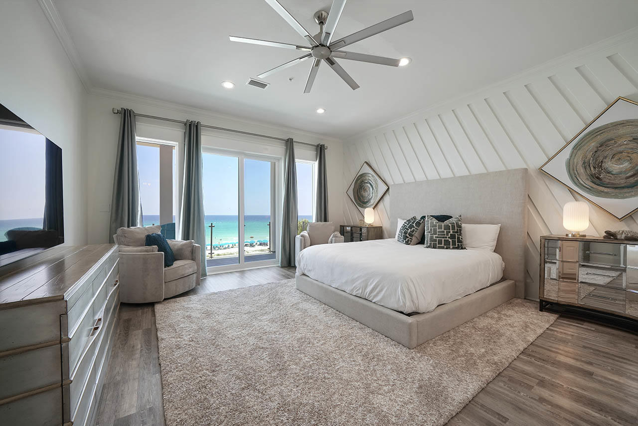 132 Sandprint Circle Destin, FL 32541 - Photo 29 of 117 a spacious bedroom with a large bed and a chandelier