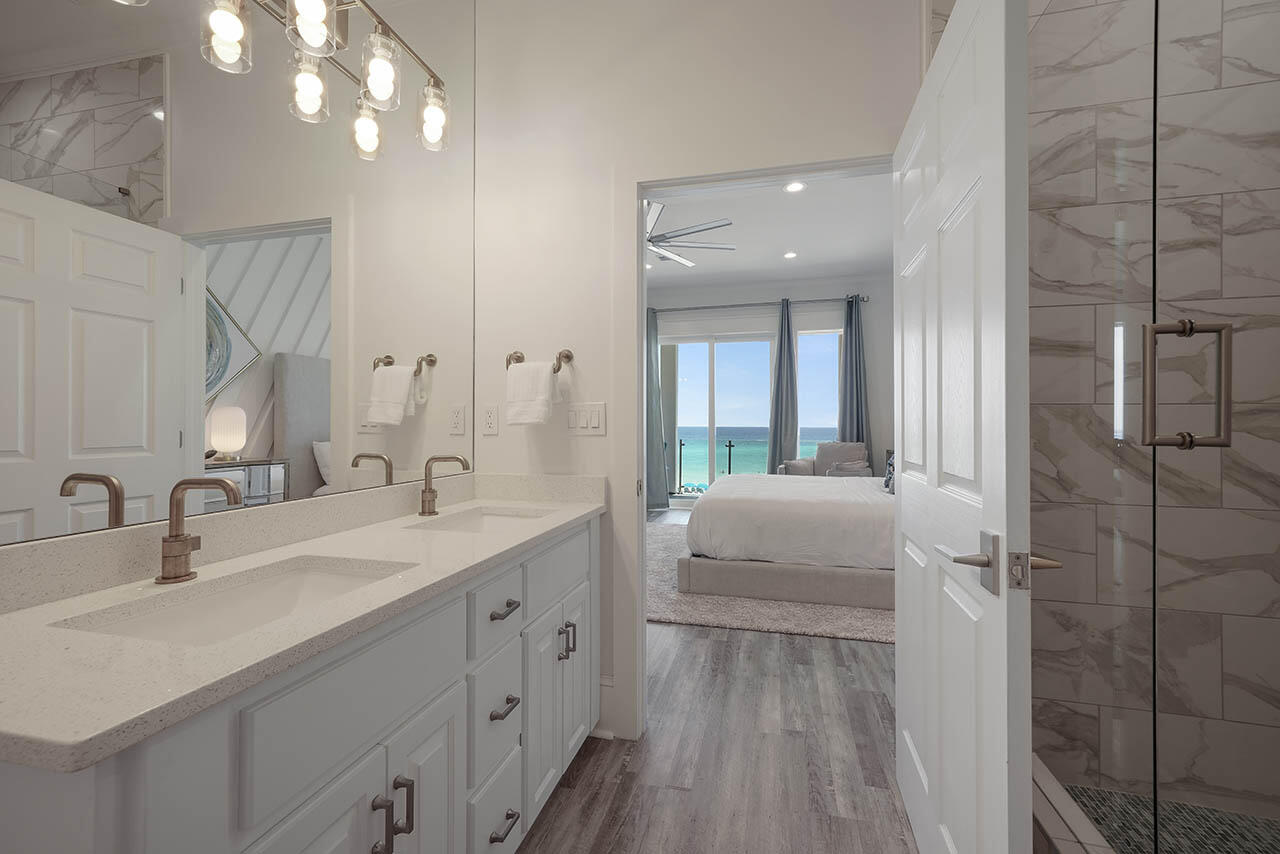 132 Sandprint Circle Destin, FL 32541 - Photo 33 of 117 a en suite bathroom with a double vanity sink a mirror and shower