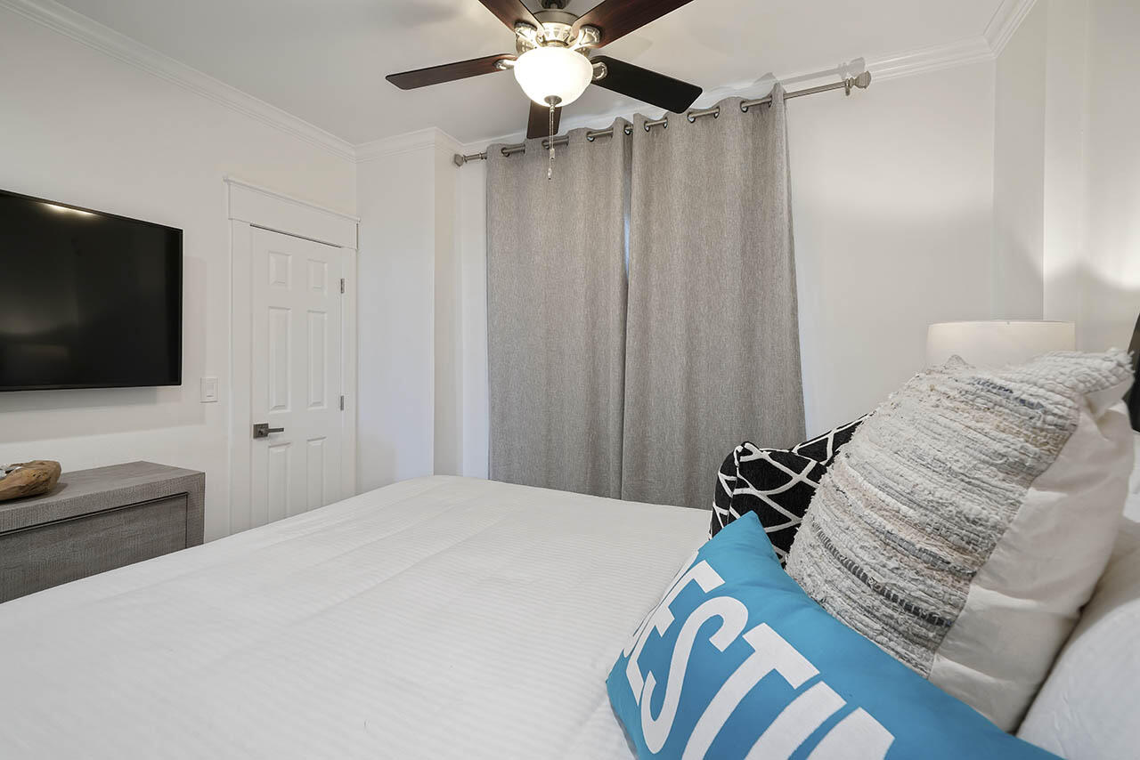 132 Sandprint Circle Destin, FL 32541 - Photo 34 of 117 a bedroom with a bed and a flat screen tv