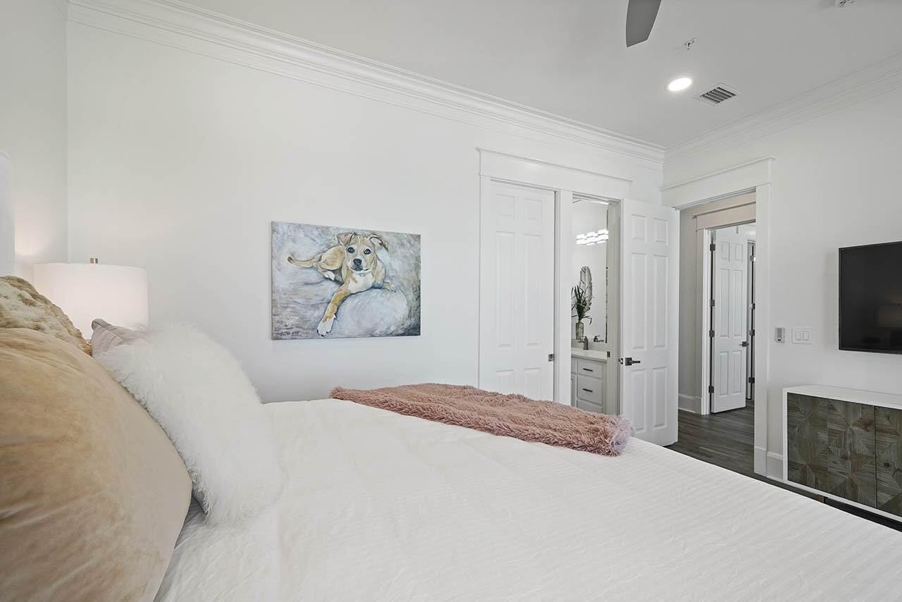 132 Sandprint Circle Destin, FL 32541 - Photo 41 of 117 a bedroom with a large bed and a flat screen tv
