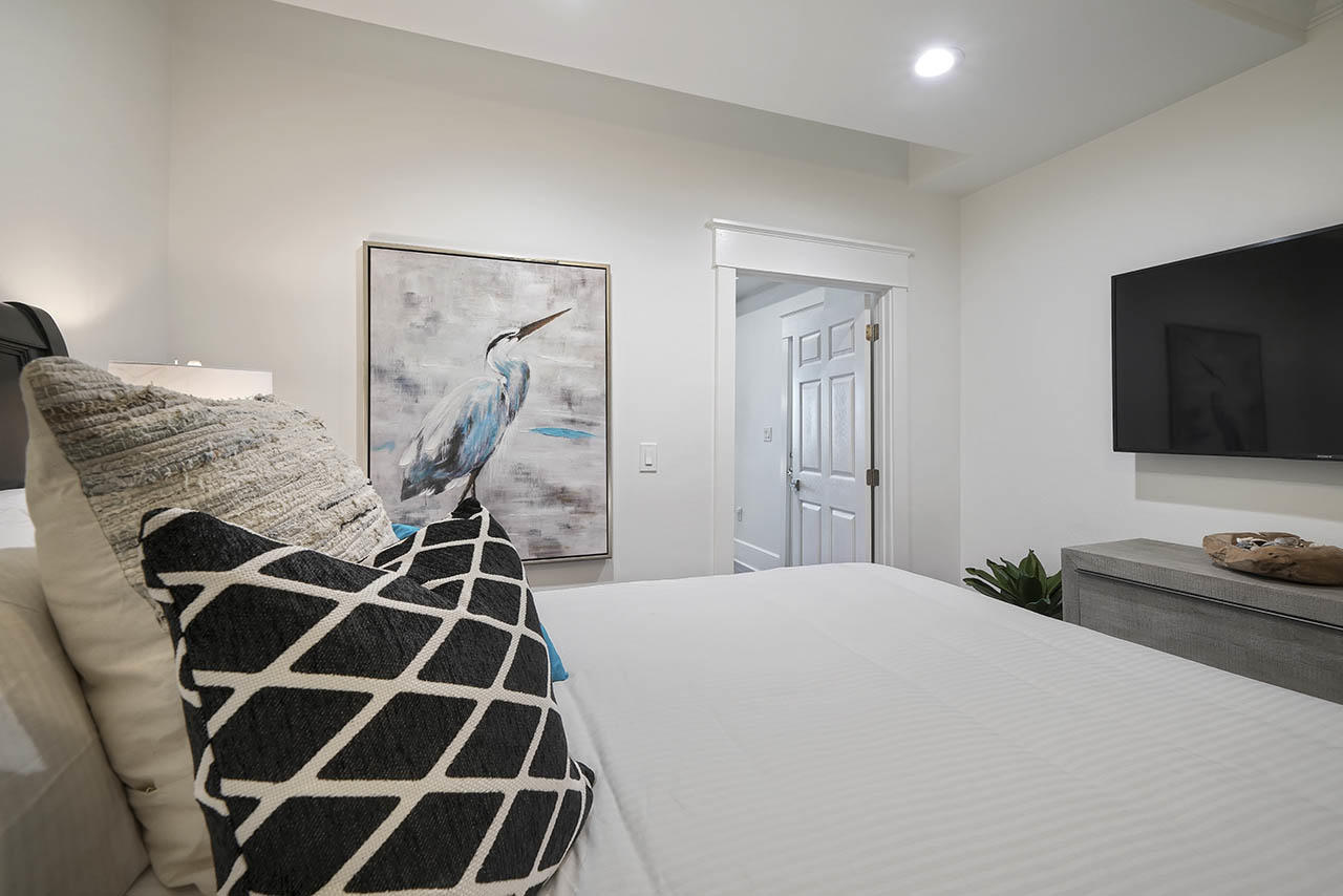 132 Sandprint Circle Destin, FL 32541 - Photo 44 of 117 a bedroom with a bed and a flat tv screen on the dresser