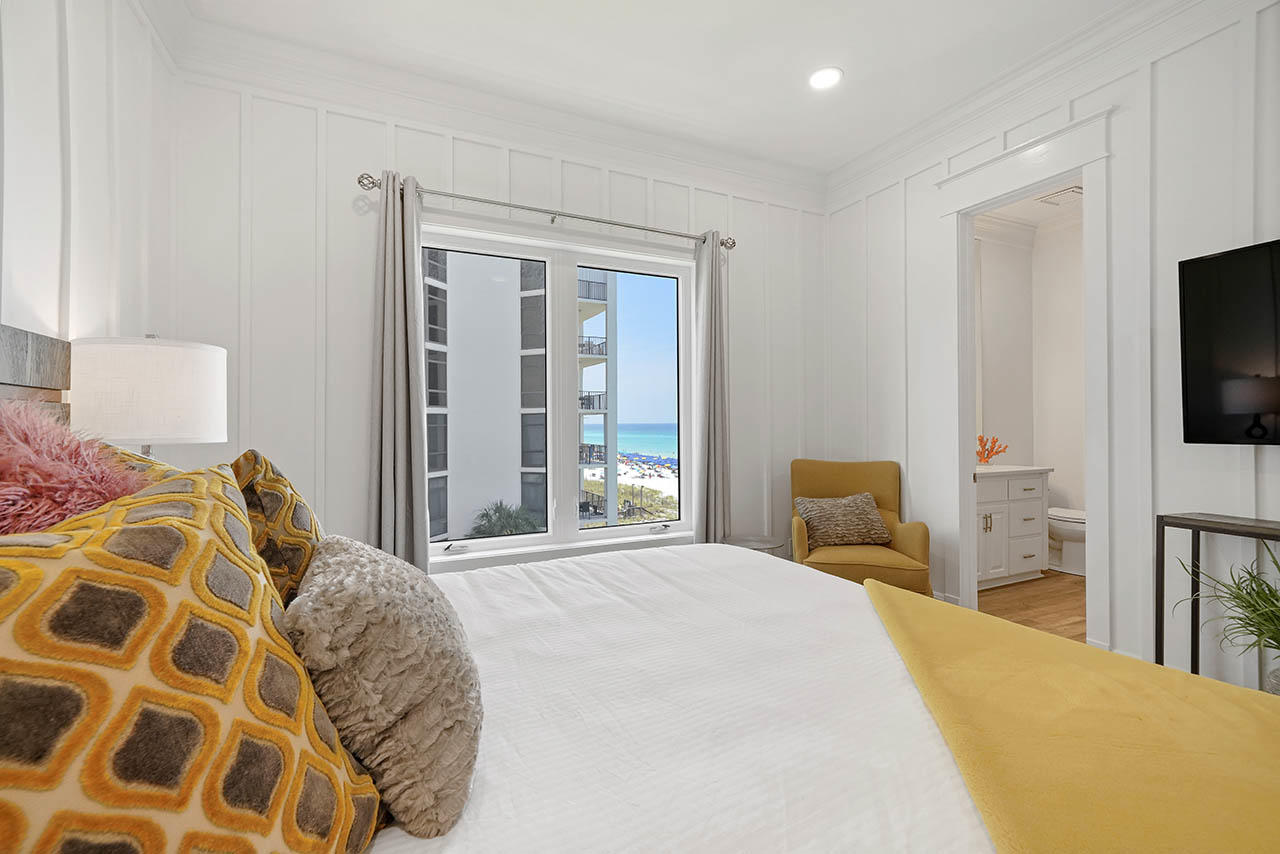 132 Sandprint Circle Destin, FL 32541 - Photo 45 of 117 a bedroom with a bed and a flat tv screen next to a window