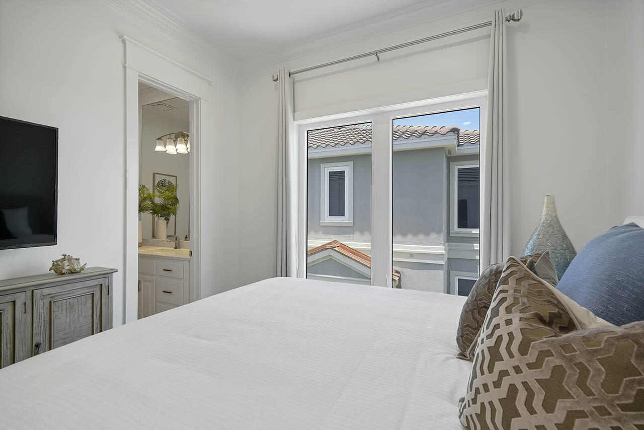 132 Sandprint Circle Destin, FL 32541 - Photo 50 of 117 a bedroom with a large bed and a flat tv screen