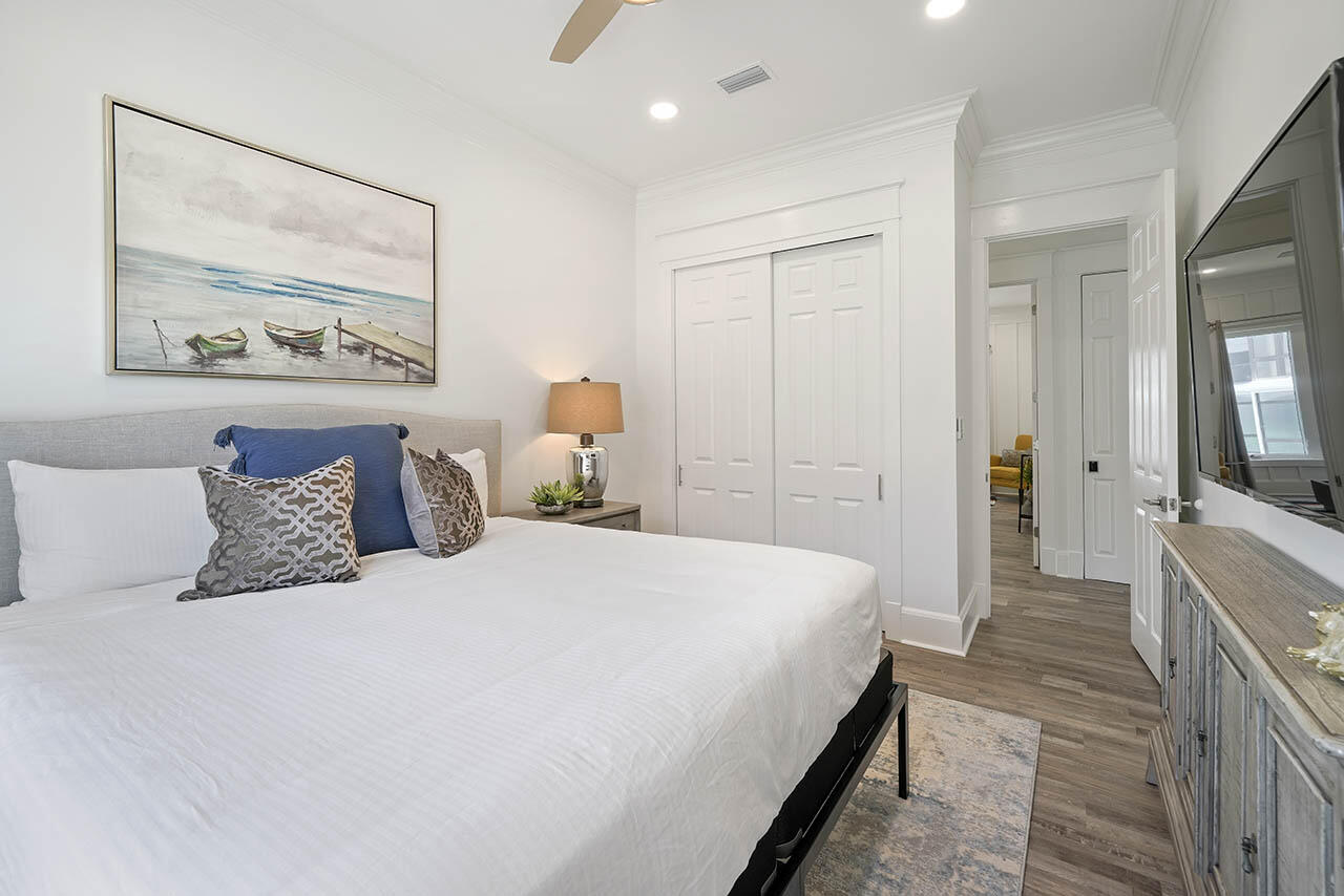 132 Sandprint Circle Destin, FL 32541 - Photo 51 of 117 a bedroom with a bed and a painting on the wall