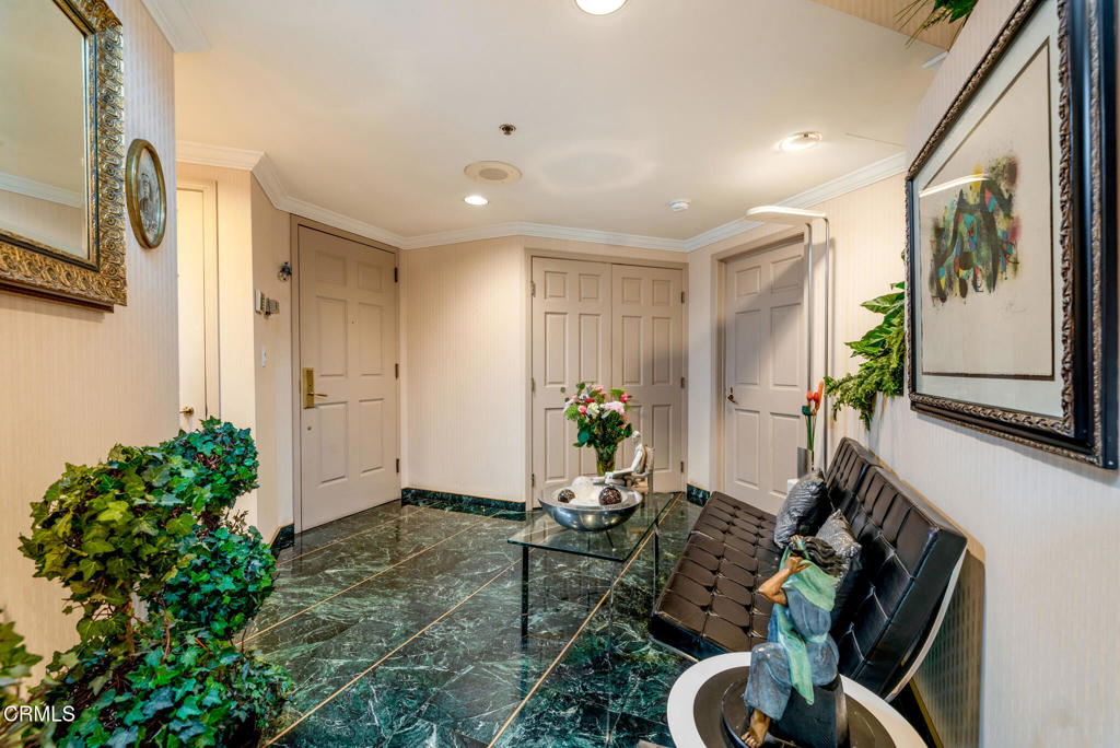 10724 Wilshire Boulevard, Unit 607 Los Angeles, CA 90024 - Photo 11 of 33 a living room with furniture and flowers
