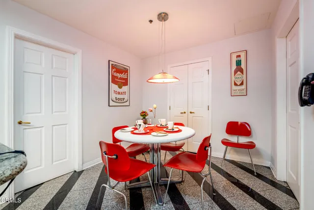 a bed sitting in a room next to a window