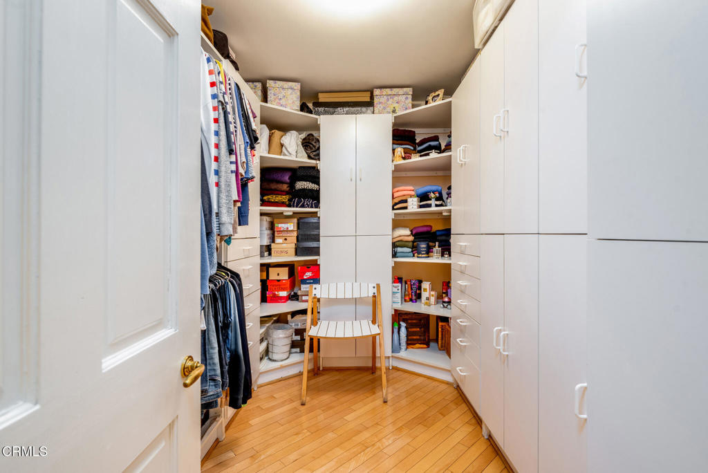 10724 Wilshire Boulevard, Unit 607 Los Angeles, CA 90024 - Photo 23 of 33 a view of walk in closet with clothes and shoes