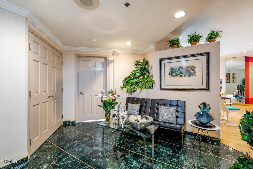 10724 Wilshire Boulevard, Unit 607 Los Angeles, CA 90024 - Photo 10 of 33 a living room with furniture potted plant and a window