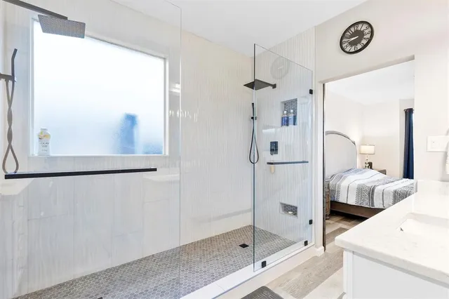 a bathroom with a bathtub and a shower