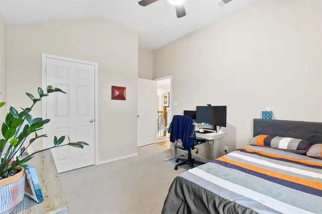 a bedroom with a workspace