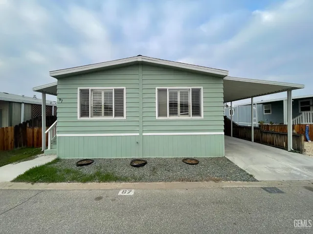 a house with trees in the background