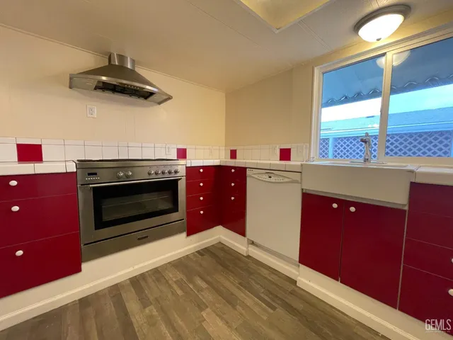 a kitchen with stainless steel appliances a stove and a refrigerator