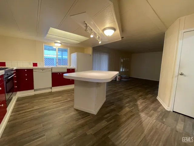 a view of a kitchen with a sink and cabinet