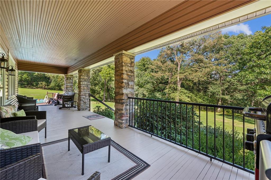 1239 New Stanton Ruffsdale Road Ruffs Dale, PA 15679 - Photo 27 of 47 a balcony with furniture and wooden floor