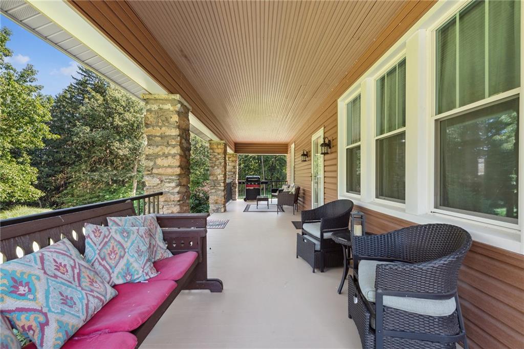 1239 New Stanton Ruffsdale Road Ruffs Dale, PA 15679 - Photo 28 of 47 a balcony with furniture and a garden