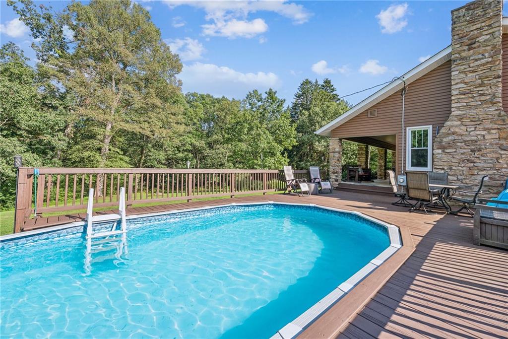1239 New Stanton Ruffsdale Road Ruffs Dale, PA 15679 - Photo 31 of 47 a view of a house with swimming pool and sitting area