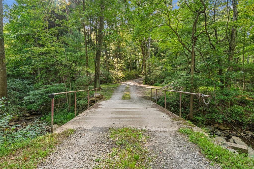 1239 New Stanton Ruffsdale Road Ruffs Dale, PA 15679 - Photo 32 of 47 a view of a pathway with a wrought fence