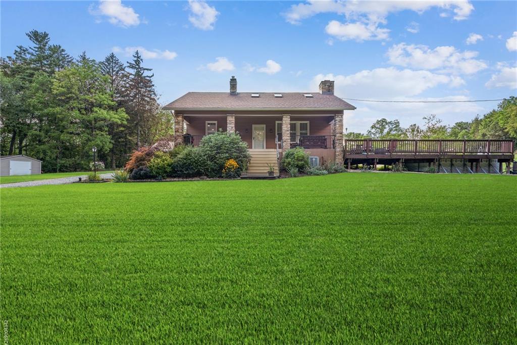 1239 New Stanton Ruffsdale Road Ruffs Dale, PA 15679 - Photo 33 of 47 a front view of a house with a yard
