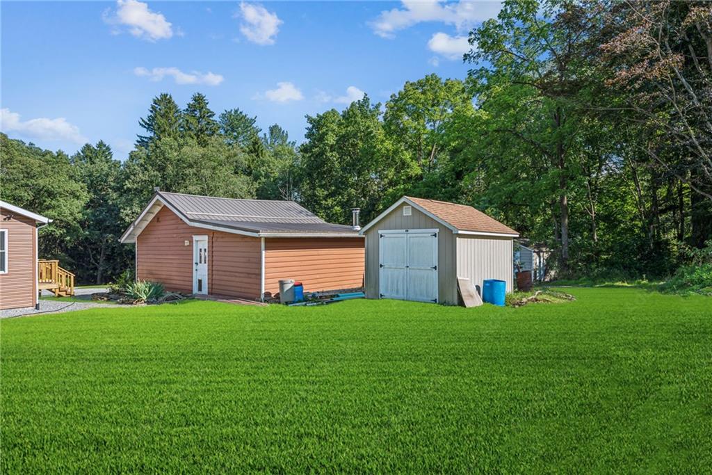 1239 New Stanton Ruffsdale Road Ruffs Dale, PA 15679 - Photo 37 of 47 a front view of a house with yard and green space