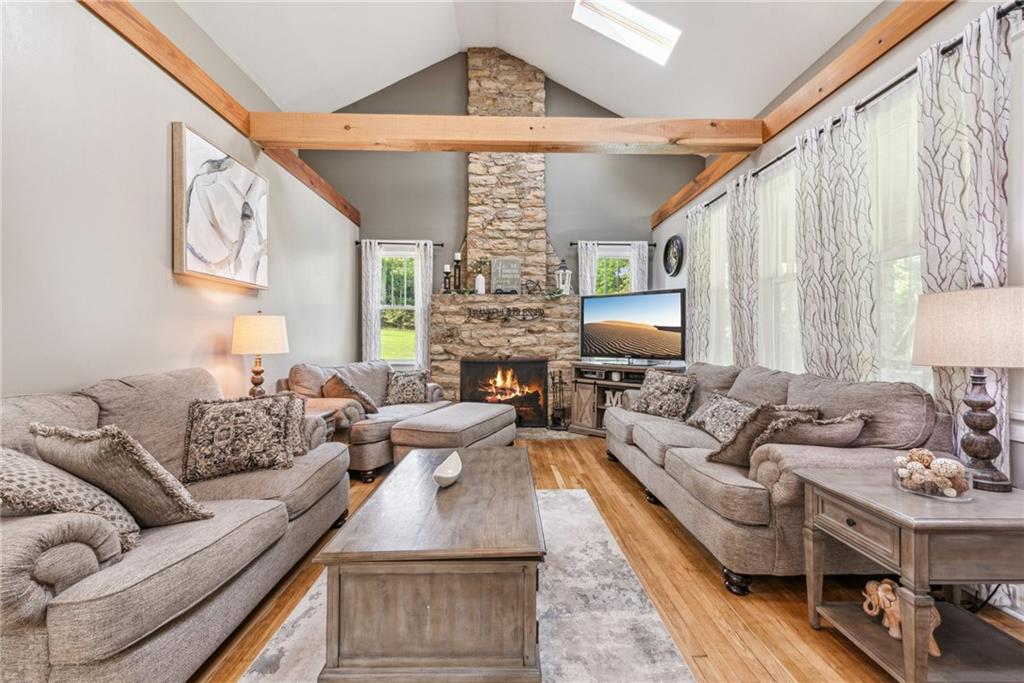 1239 New Stanton Ruffsdale Road Ruffs Dale, PA 15679 - Photo 7 of 47 a living room with fireplace furniture and a large window