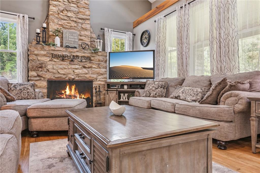 1239 New Stanton Ruffsdale Road Ruffs Dale, PA 15679 - Photo 9 of 47 a living room with furniture and a fireplace