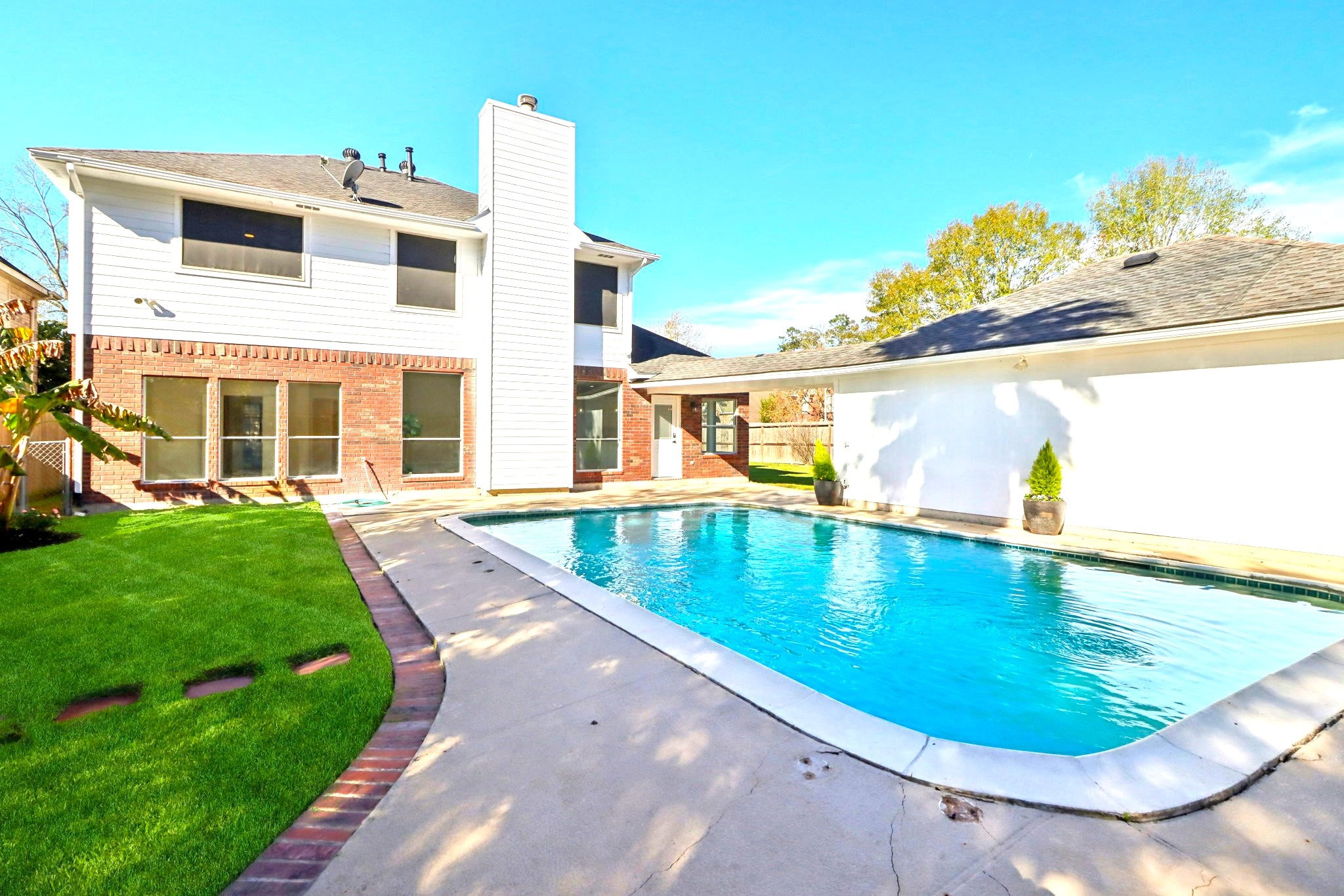 30122 Falher Drive Spring, TX 77386 - Photo 33 of 36 a view of a swimming pool with a yard