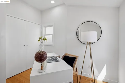 a view of a backyard with plants and a wooden fence