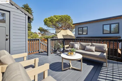 a view of a house with a yard and a garden