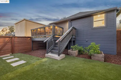 a balcony with furniture and wooden floor