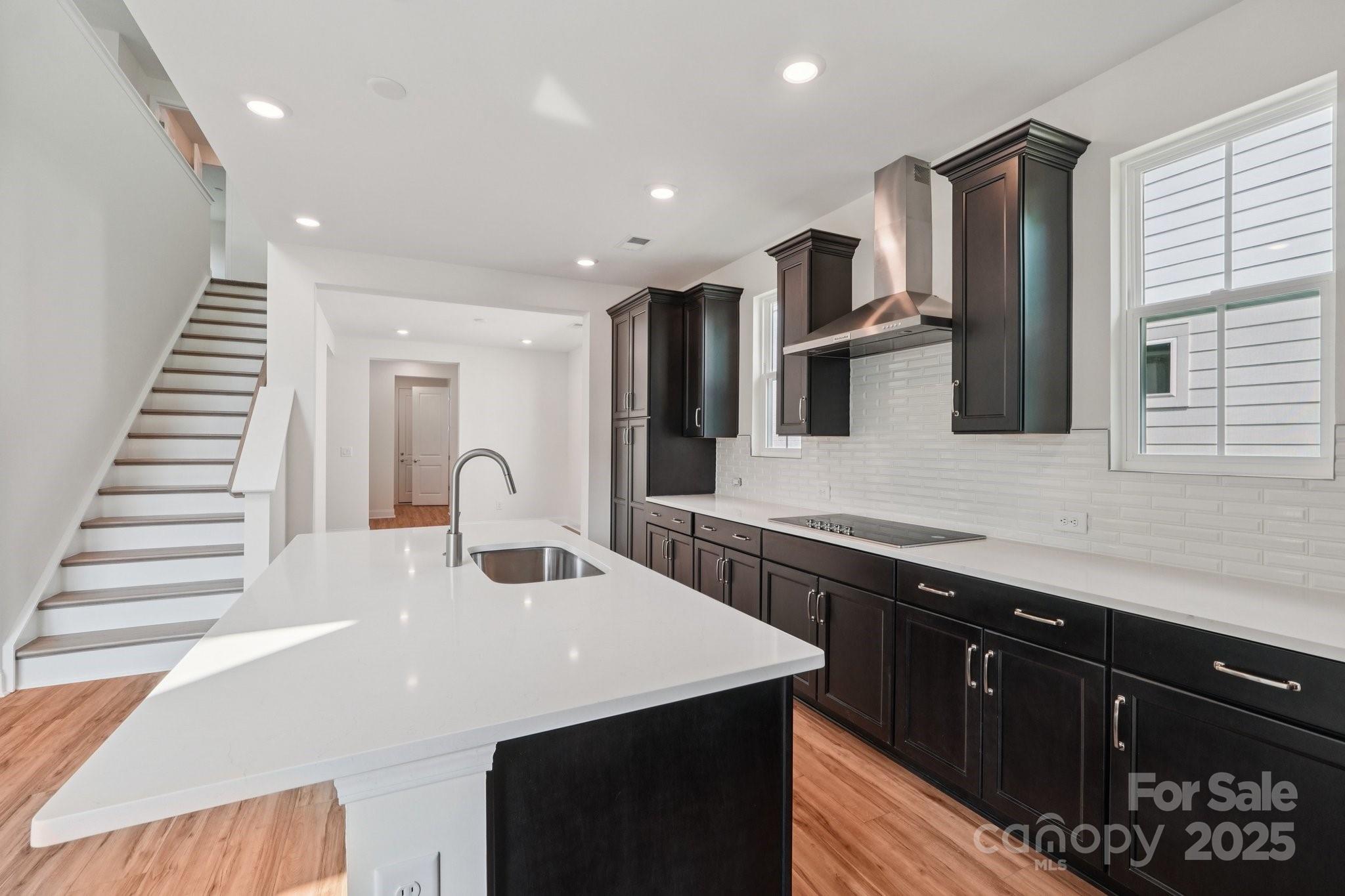 716 Flare Drive Tega Cay, SC 29708 - Photo 3 of 19 a kitchen with a sink stainless steel appliances and cabinets