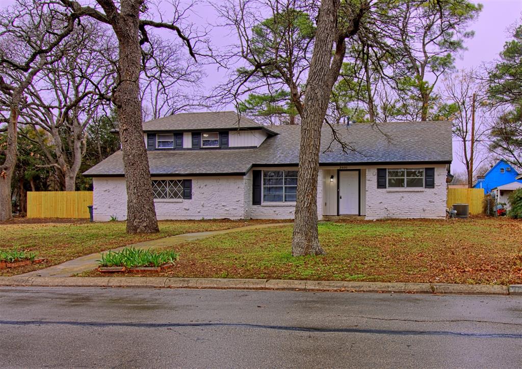 3601 Falcon Drive Forest Hill, TX 76119 - Photo 1 of 1 a front view of a house with a garden and tree