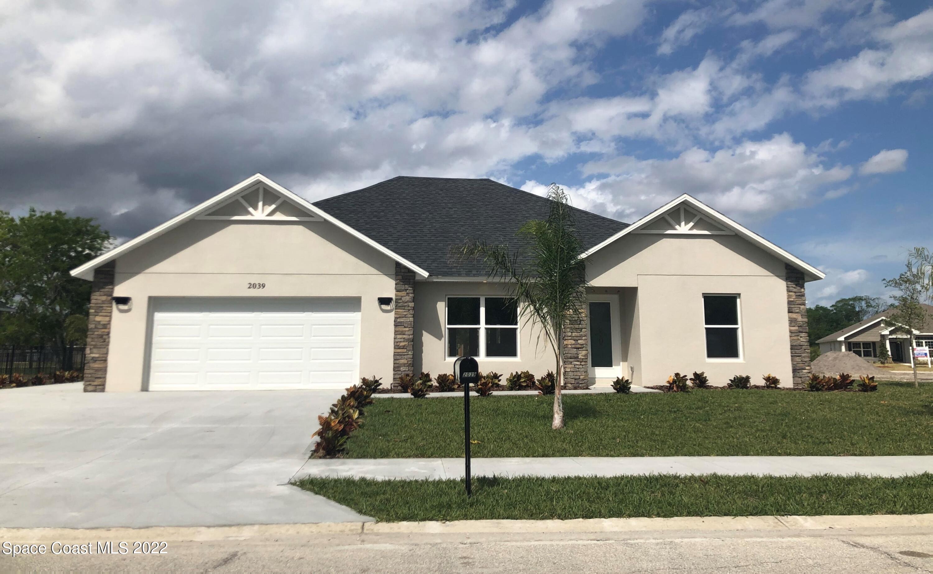4035 Grant Line Road Mims, FL 32754 - Photo 1 of 18 a front view of a house with a yard