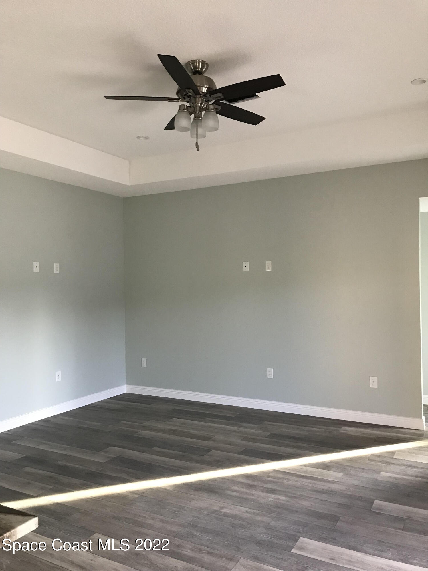 4035 Grant Line Road Mims, FL 32754 - Photo 5 of 18 a view of a ceiling fan and wooden floor